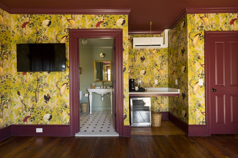 bathroom, tv, and breaksfast nook inside room 301